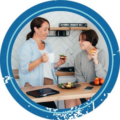 Teen talking to mom in the kitchen